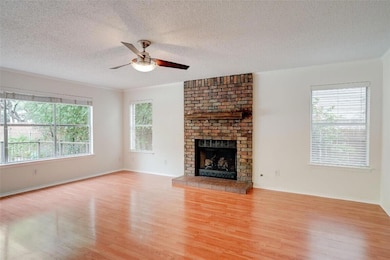 Unfurnished living room featuring wood finished f