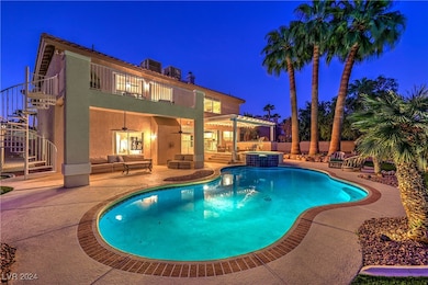 Surrounded by mature palm trees, the backyard oasi