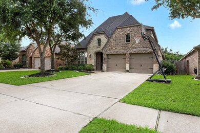 Home is professionally landscaped yard and a brick and stone elevation, adding to its charm and curb appeal.