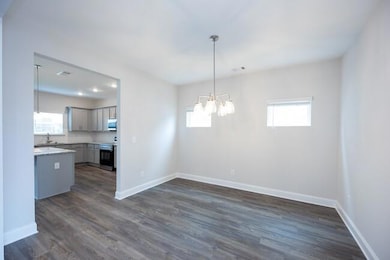 Unfurnished dining area with baseboards and a wealth of natural light