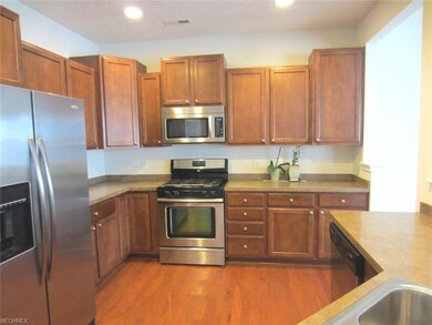 Kitchen offers all appliances, wood flooring, larg