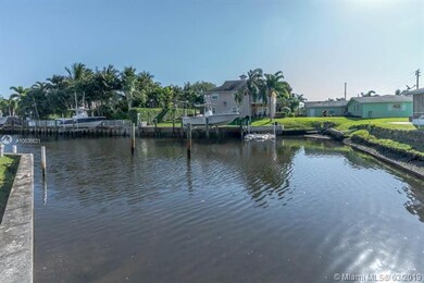 Wide canal view. Needs a new seawall and dock.