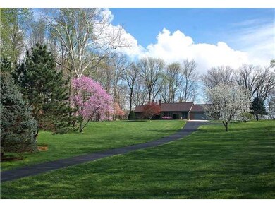 Exterior Front. Long paved drive back to home. Spring blossoms, flowers, trees and birds on property to enjoy!