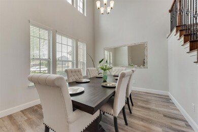 Obstructed view of property featuring a garage and a front yard