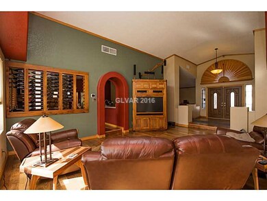 Property Photo. LIVING ROOM WITH CUSTOM WINE RACK