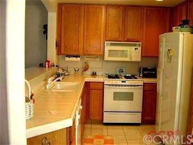 Tile counters in this efficient kitchen!