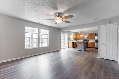 Living room with view of kitchen
