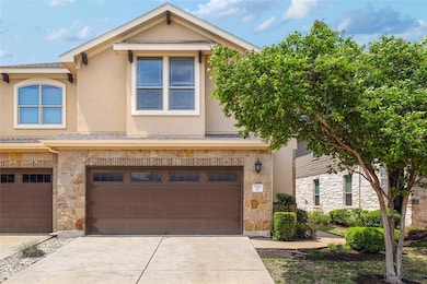 Townhome / multi-family property featuring an att