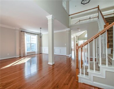 Front entry boasts beautiful hardwood floors