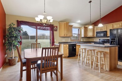 Dining and kitchen with patio door to spacious deck and fenced in yard