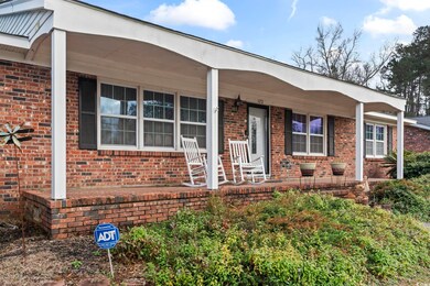 Ranch-style home featuring covered porch