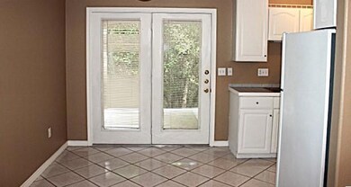 Doorway with light tile patterned flooring, frenc
