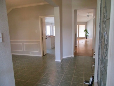 Come in to the wide foyer and dining room to the left. A study is to your right.