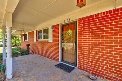 Doorway to property featuring a porch