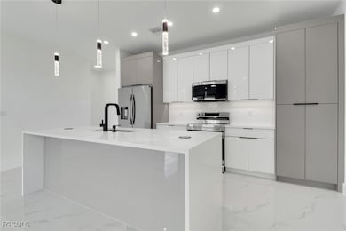 928 NE 8th Place, Cape Coral, FL 33909 - photo 2