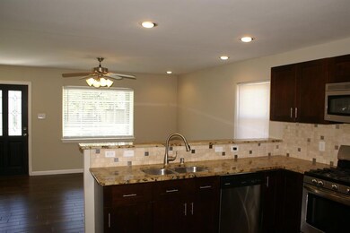 Large kitchen with upgraded designer granite.  Cus