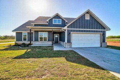View of front of house featuring a garage and a fr