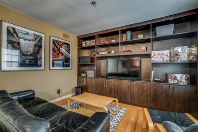 The open living area features beautiful custom cab
