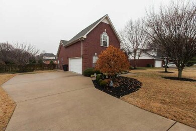 Concrete driveway, freshly mulched landscaping