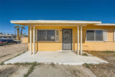 Entrance to property with stucco siding