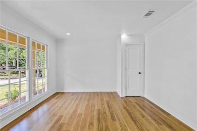 Unfurnished room featuring light wood-style flooring and recessed lighting