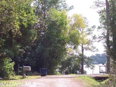 In the road at the driveway, looking to the water.