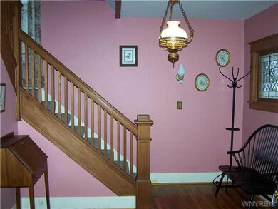 Living Room. Wood Banister Staircase from living r
