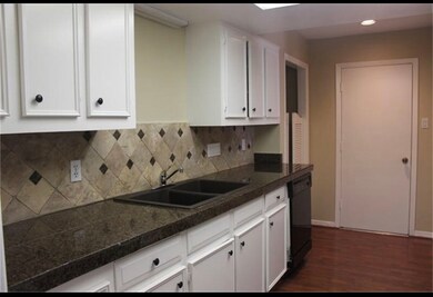 Photo of previous kitchen . Appliances have been upgraded including black stainless refrigerator, stove , microwave and stainless dishwasher .