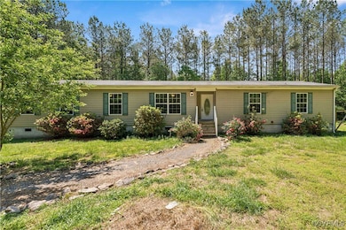 View of front facade featuring a front yard and cr