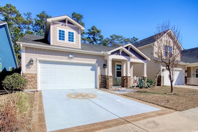 Craftsman house featuring covered porch, stone sid
