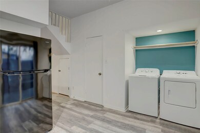 Full size washer and dryer in the kitchen area.
