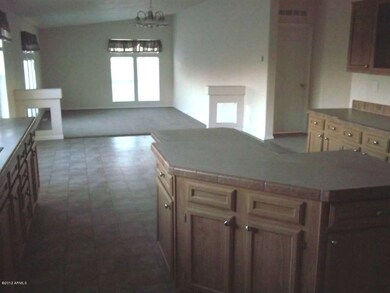 Kitchen with view step down living room