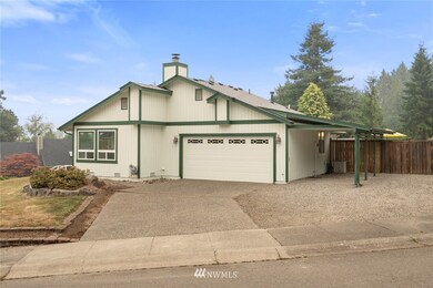 2 car garage with additional covered parking and notice the A/C!