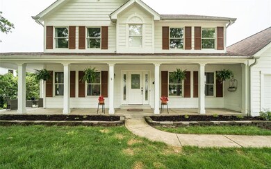 This wrap around front porch creates magnetic curb