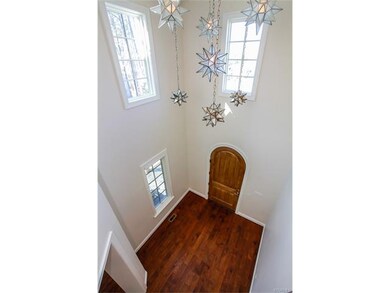 As you enter the 2 story foyer, you are greeted wi