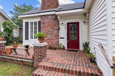 View of exterior entry featuring a patio