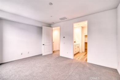 Primary bedroom with en suite bathroom.