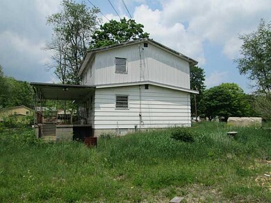 Exterior Back. Another view of the side of the hom