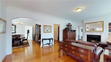 View of formal Living Room with arched entryway to