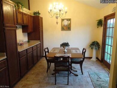 Dinette off kitchen with additional cabinets and c