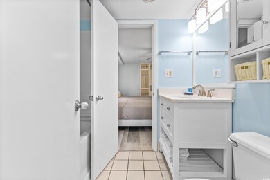 Bathroom featuring vanity, toilet, and hardwood / 