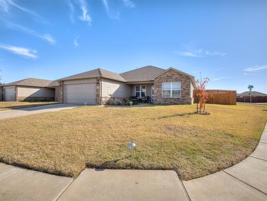 Ranch-style home featuring a shingled roof, brick siding, concrete driveway, and a garage