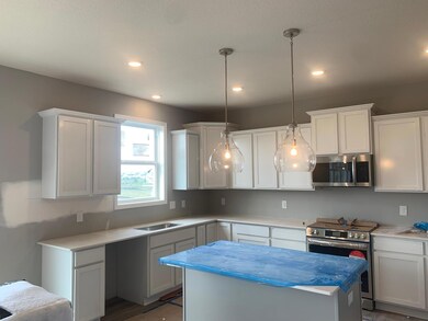 Open and naturally bright, the home's kitchen space is highly desirable and features a Quartz island serving as the perfect centerpiece for entertaining! Model home.