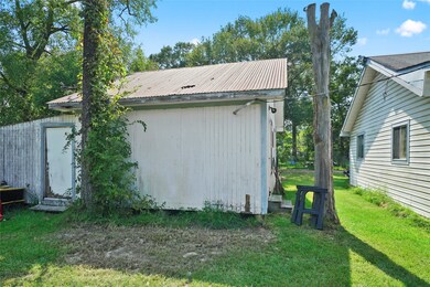 Storage building directly behind the house.