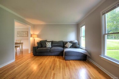 The formal living room provides plenty of space fo