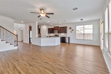 Unfurnished living room with light wood-type floo