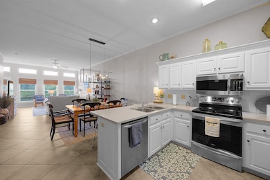 Kitchen with stainless steel appliances, a sink, o