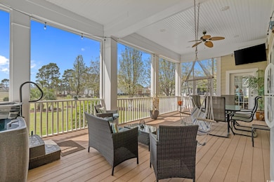 Sunroom featuring outdoor dining area and a ceiling fan