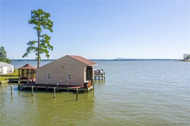 Boathouse with a boat lift on the tail end of Meac