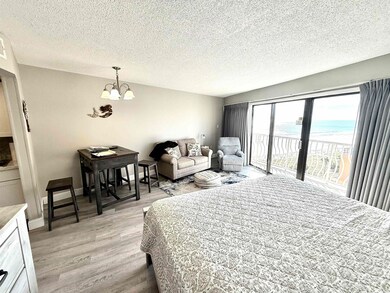 Bedroom with access to exterior, light hardwood / 